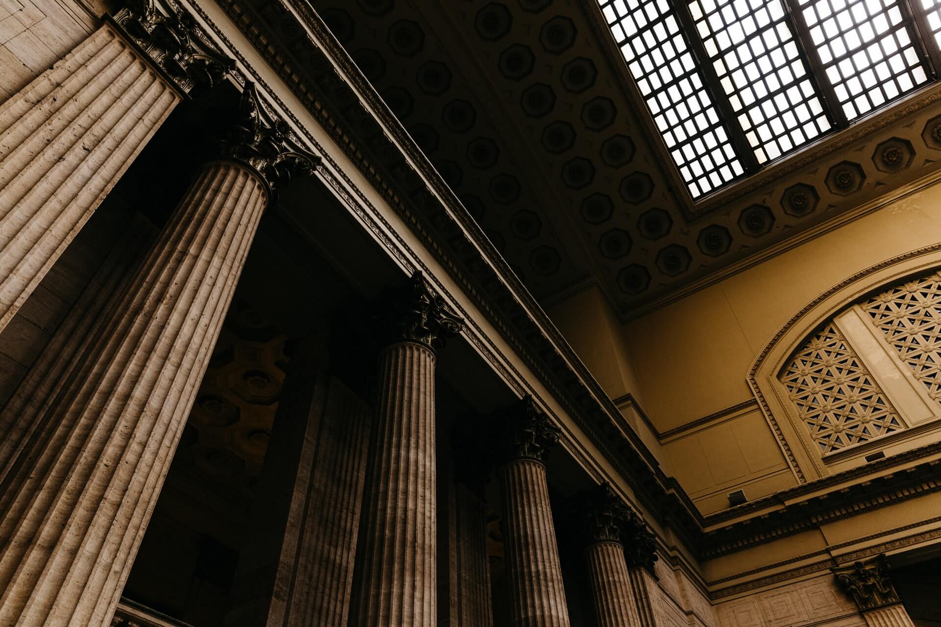 Stone columns used as a stand-in interior for COMPANY_NAME in TOWN. Replace this with your own office photo after you pay.